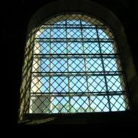 Glass windows began appearing in castles in the late 12th century. This window is from the Cloisters Museum in New York